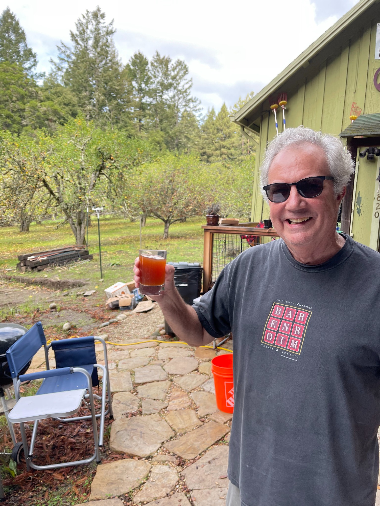 Tom O’Bryan enjoying a glass of cider in the orchard